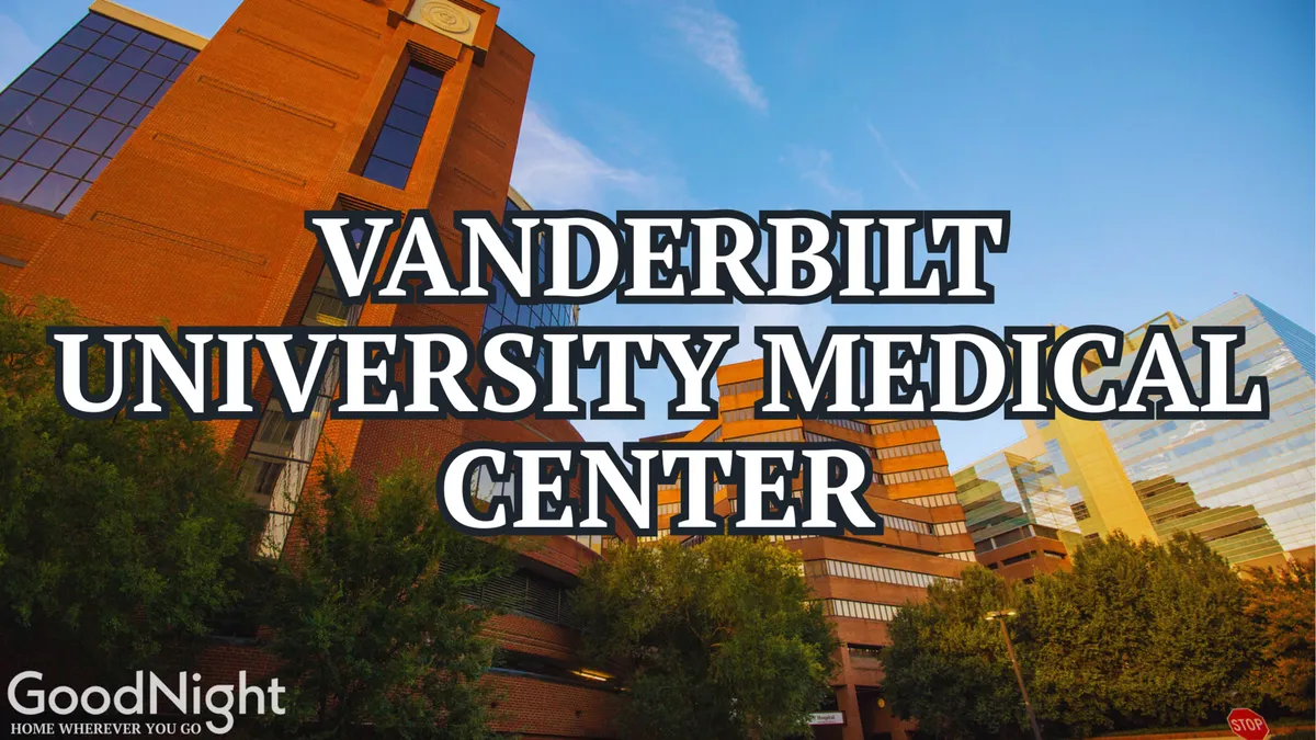 This exterior image highlights the Vanderbilt University Medical Center building set against lush greenery and a clear sky. The modern architectural style and calm surroundings are visible, signaling proximity to a major business and healthcare hub.